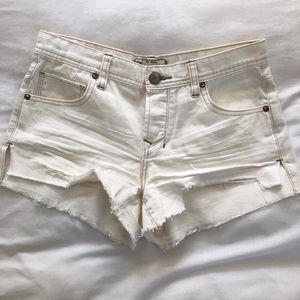 Free People white distressed denim shorts